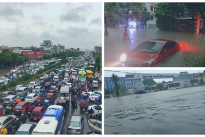 Tắc đường kinh hoàng, ô tô vất vả "bơi" trên đường sau trận mưa lớn