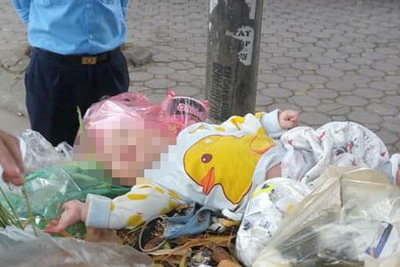 Bé trai khoảng 5 tháng tuổi bị bỏ rơi ở thùng rác trên đường Doãn Kế Thiện