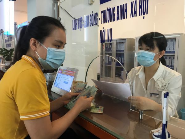 Hà Nội hỗ trợ kinh phí cho gần 86.000 lao động tự do 128,49 tỷ đồng - Ảnh 1