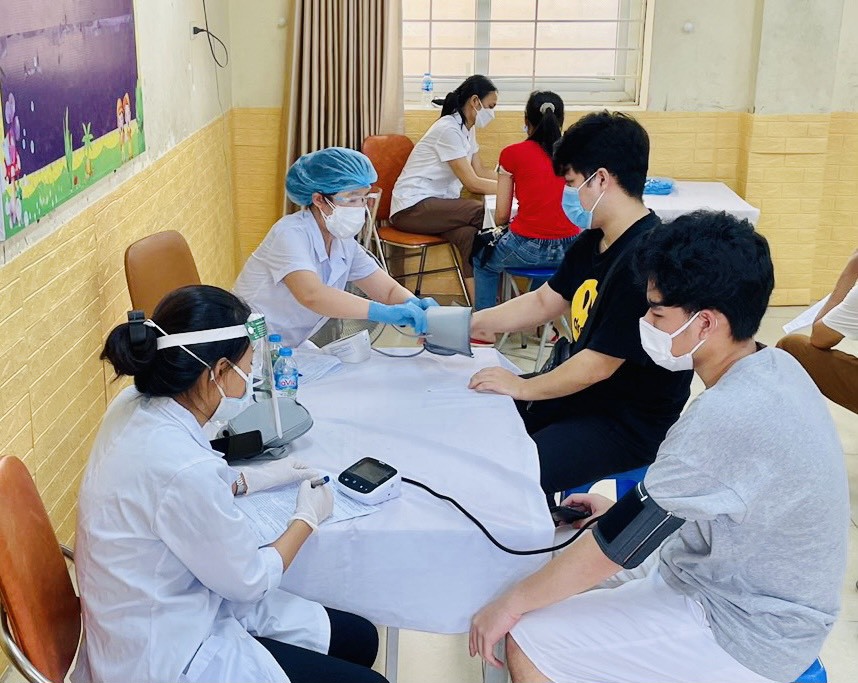 Chùm ảnh: Quận Thanh Xuân đẩy nhanh chiến dịch tiêm chủng vaccine phòng Covid-19 quy mô lớn - Ảnh 4