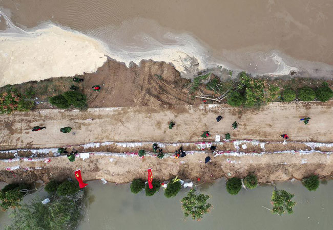 Lũ lụt kinh hoàng tại Trung Quốc: Ít nhất 29 người chết, hàng trăm ngàn người phải đi sơ tán - Ảnh 3