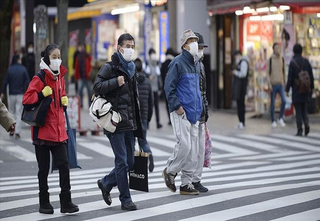 Ca nhiễm Covid-19 vẫn tăng kỷ lục, Nhật Bản tiếp tục gia hạn tình trạng khẩn cấp - Ảnh 1