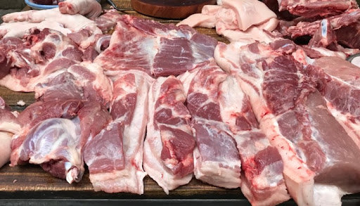 Giá thịt lợn tiếp tục hạ nhiệt - Ảnh 1