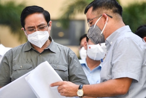 Thủ tướng Phạm Minh Chính kiểm tra Bệnh viện dã chiến 18.000 giường ở TP Thủ Đức - Ảnh 1