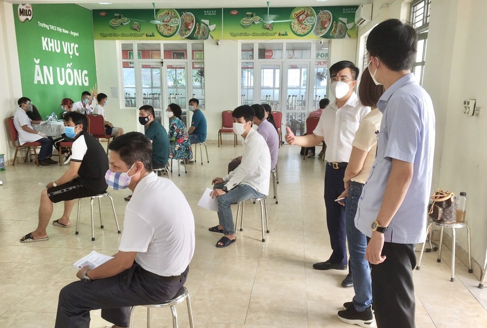 Chùm ảnh: Thêm 4.919 người dân quận Thanh Xuân tiêm vaccine phòng Covid-19 - Ảnh 3