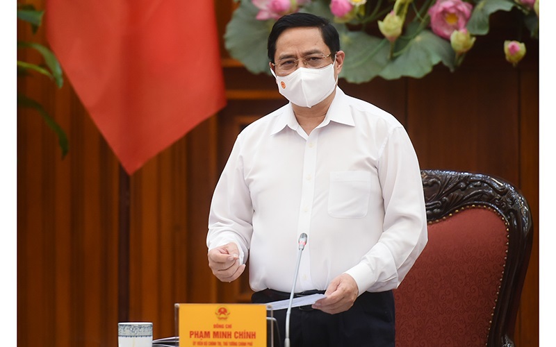 Thủ tướng Phạm Minh Chính chủ trì họp khẩn về phòng chống Covid-19 - Ảnh 1