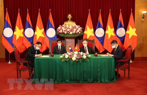 Lãnh đạo Việt - Lào chứng kiến Lễ ký kết văn kiện hợp tác giữa 2 nước - Ảnh 2