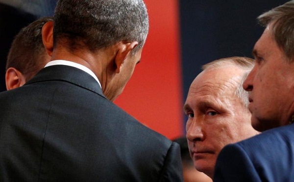Cuộc gặp 4 phút của Tổng thống Mỹ, Nga về Syria - Ảnh 1