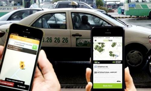 Đề nghị áp thuế giá trị gia tăng 5% với Grab và Uber - Ảnh 1