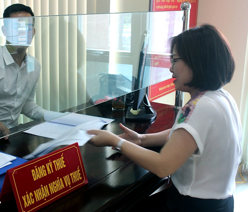 Thí điểm nộp lệ phí trước bạ điện tử đối với ô tô, xe máy tại Hà Nội và TP Hồ Chí Minh - Ảnh 1