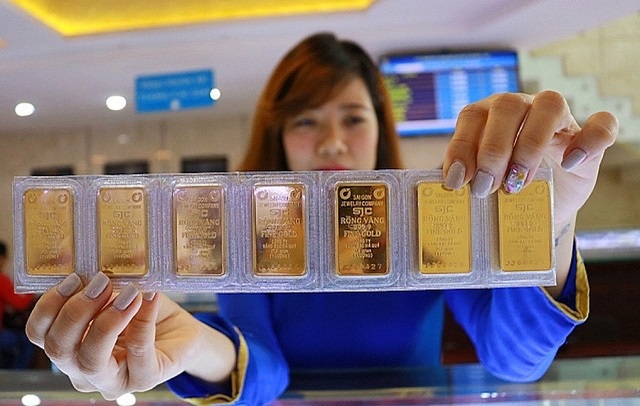 Giá vàng đảo chiều tăng nhờ Trung Quốc hạ lãi suất kích thích kinh tế - Ảnh 1