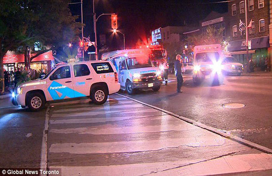 Hiện trường vụ xả súng dữ dội tại TP Toronto của Canada, 13 người thương vong - Ảnh 4