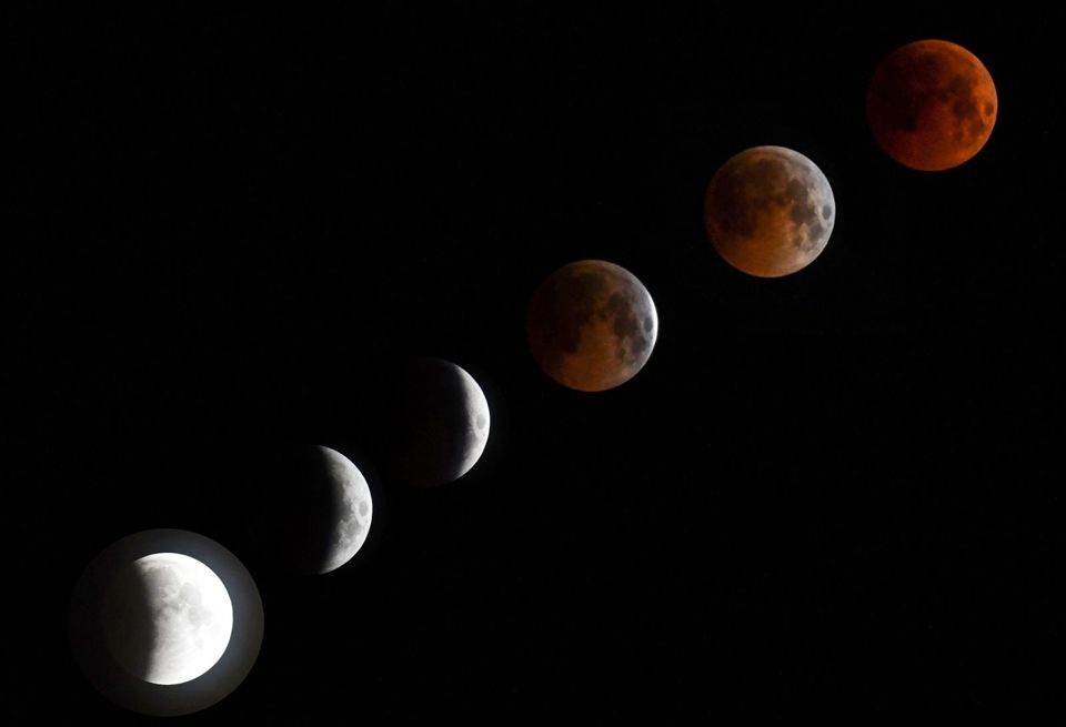 Hình ảnh "trăng máu" - nguyệt thực dài nhất thế kỷ trên thế giới - Ảnh 1