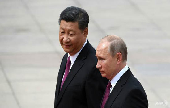 Tổng thống Putin: Nga, Trung Quốc sẽ hạn chế sử dụng đồng USD trong giao dịch thương mại - Ảnh 1