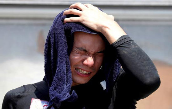Chùm ảnh người dân Nhật Bản "oằn mình" chống chọi đợt nắng nóng kỷ lục - Ảnh 5