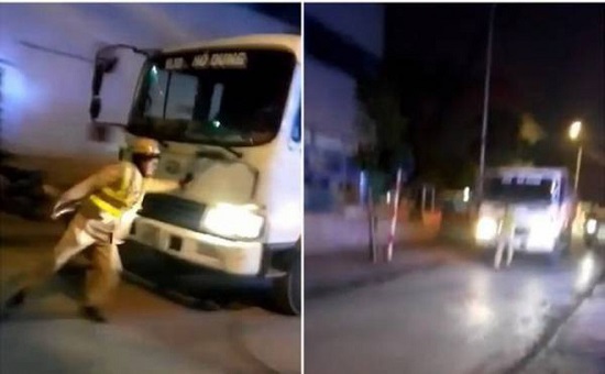 Hà Nội: Tạm giữ hình sự tài xế lao thẳng xe tải vào cảnh sát giao thông - Ảnh 1