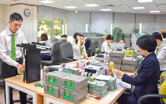 Vietcombank sẵn sàng phục vụ nhu cầu rút tiền của khách hàng dịp Tết Nguyên đán - Ảnh 1