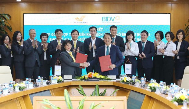 BIDV và Vietnam Post hợp tác triển khai dịch vụ thu hộ bảo hiểm   - Ảnh 1