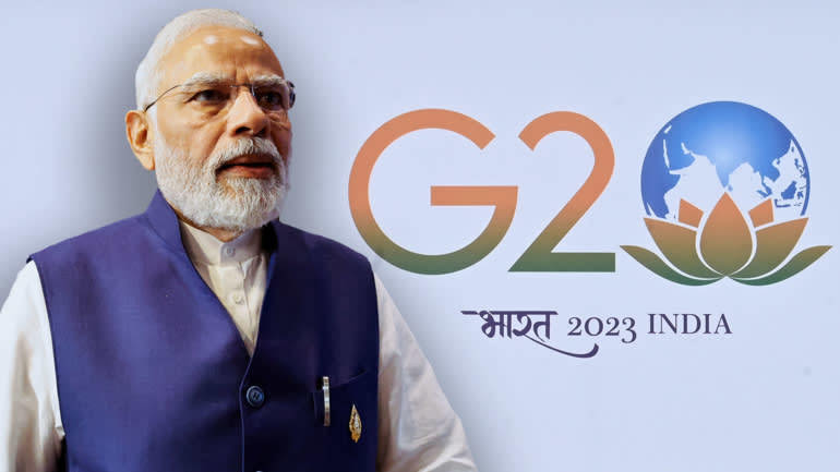 Thủ tướng Narendra Modi v&agrave; biểu tượng G20 mới của Ấn Độ. Ảnh: Reuters