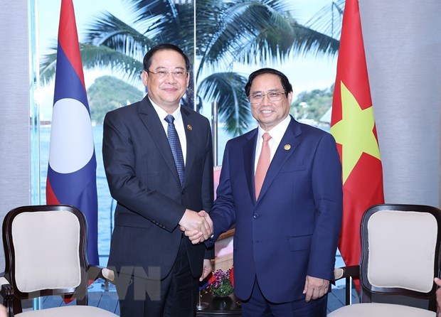 Thủ tướng Phạm Minh Ch&iacute;nh gặp Thủ tướng L&agrave;o Sonexay Siphandone. (Ảnh: Dương Giang/TTXVN)
