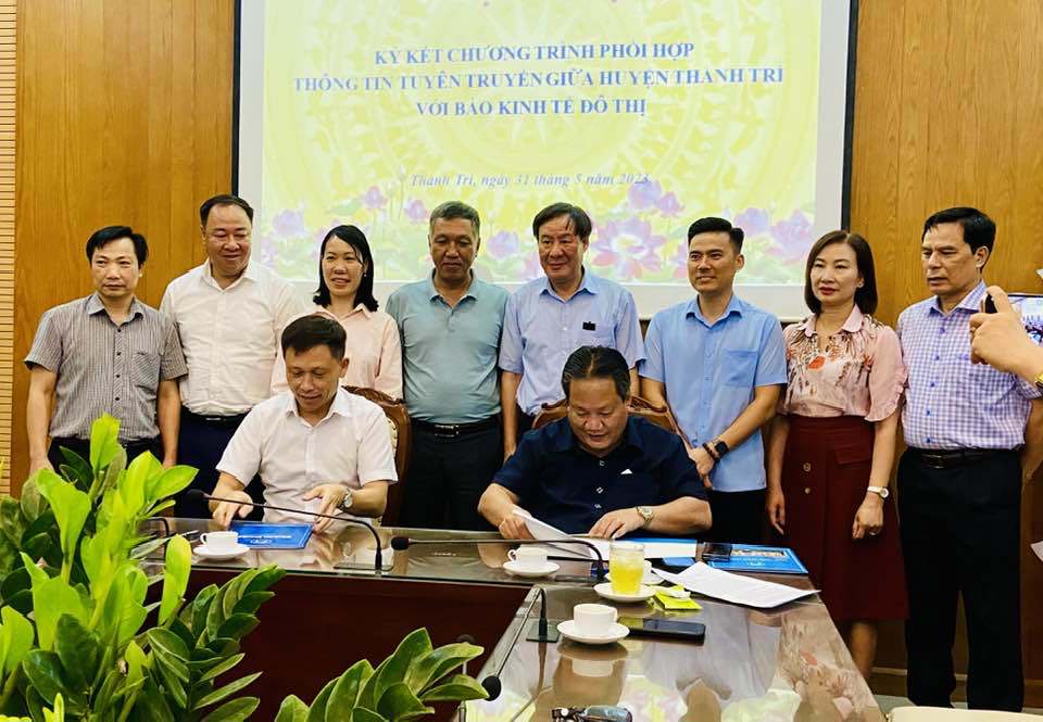 Báo Kinh tế và Đô thị ký kết chương trình phối hợp với huyện Thanh Trì - Ảnh 1