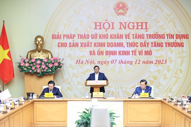 Thủ tướng Phạm Minh Ch&iacute;nh chủ tr&igrave; Hội nghị b&agrave;n giải ph&aacute;p th&aacute;o gỡ kh&oacute; khăn về tăng trưởng t&iacute;n dụng cho sản xuất, kinh doanh th&uacute;c đẩy tăng trưởng v&agrave; ổn định kinh tế vĩ m&ocirc;. Ảnh VGP